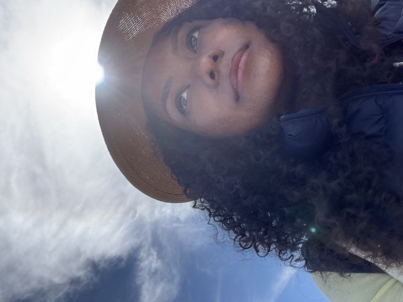 Faith Lantz outdoors in a hat